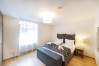 Łóżko lub łóżka w pokoju w obiekcie Apartmenthaus Pastner am Teich