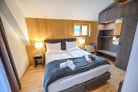 Łóżko lub łóżka w pokoju w obiekcie Apartmenthaus Pastner am Teich