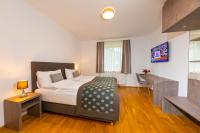 Łóżko lub łóżka w pokoju w obiekcie Apartmenthaus Pastner am Teich