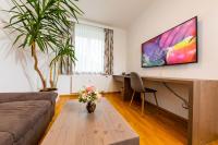 Telewizja i/lub zestaw kina domowego w obiekcie Apartmenthaus Pastner am Teich