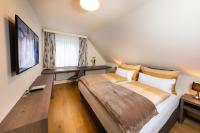 Telewizja i/lub zestaw kina domowego w obiekcie Apartmenthaus Pastner am Teich
