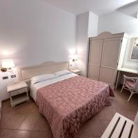 Łóżko lub łóżka w pokoju w obiekcie Hotel Terranova