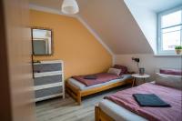 Postel nebo postele na pokoji v ubytování Aparmány Loučná nad Desnou