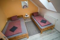 Postel nebo postele na pokoji v ubytování Aparmány Loučná nad Desnou