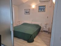 Posteľ alebo postele v izbe v ubytovaní Vidučić Apartments