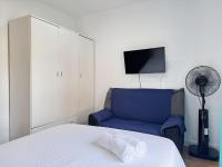 A bed or beds in a room at Apartamentos Day Madrid ILDEFONSO Centro Gran Via Sol Malasaña