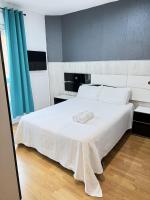 A bed or beds in a room at Apartamentos Day Madrid ILDEFONSO Centro Gran Via Sol Malasaña