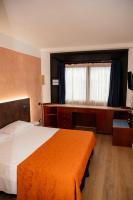 A bed or beds in a room at Hotel Sirena - B&B