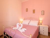 A bed or beds in a room at CASA MAFALDA - Rooms, friends and more - Affittacamere, Guest House