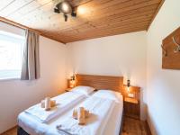 Łóżko lub łóżka w pokoju w obiekcie Alpensteinbock Saalbach D