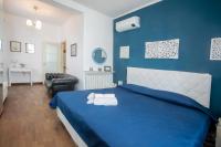 Posteľ alebo postele v izbe v ubytovaní Maison Renée Viareggio