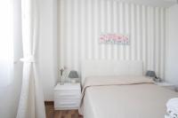 Posteľ alebo postele v izbe v ubytovaní Maison Renée Viareggio