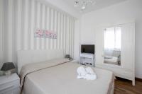 Posteľ alebo postele v izbe v ubytovaní Maison Renée Viareggio
