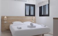 Ein Bett oder Betten in einem Zimmer der Unterkunft אורה דירות אירוח -נץ 9- דירות נופש איכותיות לנופש שקט ואקסלוסיבי