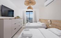 Ein Bett oder Betten in einem Zimmer der Unterkunft אורה דירות אירוח -נץ 9- דירות נופש איכותיות לנופש שקט ואקסלוסיבי
