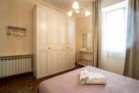 Posteľ alebo postele v izbe v ubytovaní Maison Renée Viareggio