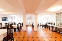 a dining room with tables and chairs at Pensiunea Petra- Clisura Dunarii in Divici