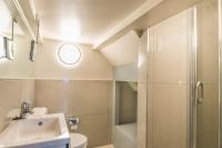 a bathroom with a toilet and a sink and a shower at Hotel Agora Brussels Grand Place in Brussels
