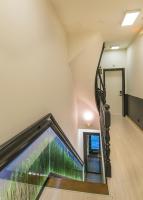 an escalator in a building with a glass wall at Hotel Agora Brussels Grand Place in Brussels