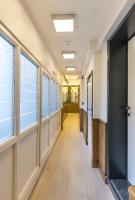 a hallway of an office building with windows at Hotel Agora Brussels Grand Place in Brussels