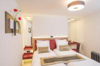 a bedroom with a bed with two pillows at Hotel Agora Brussels Grand Place in Brussels