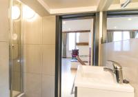 a bathroom with a sink and a shower at Hotel Agora Brussels Grand Place in Brussels