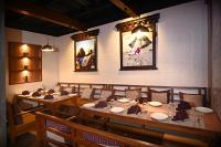 a dining room with a long table and chairs at Hotel Sherpani in Kathmandu