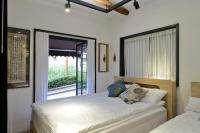 Ein Bett oder Betten in einem Zimmer der Unterkunft Jian Hanok