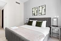 Postel nebo postele na pokoji v ubytování Silkhaus Chic 1BDR at Najmat Near Reem Central Park