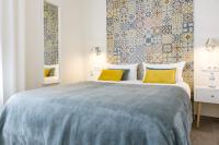 A bed or beds in a room at Chinchilla Apartment in Malaga by Solaga Holiday Homes