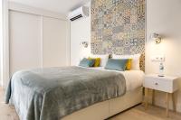 A bed or beds in a room at Chinchilla Apartment in Malaga by Solaga Holiday Homes