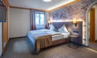 Łóżko lub łóżka w pokoju w obiekcie Hotel Königgut