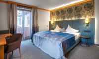 Łóżko lub łóżka w pokoju w obiekcie Hotel Königgut