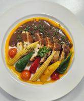 a plate of food with meat and vegetables on a plate at Claridge Star Hotel in Ras al Khaimah