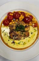 a plate of food with meat and vegetables on it at Claridge Star Hotel in Ras al Khaimah