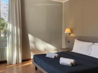 A bed or beds in a room at Casa al Lago