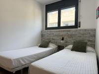 A bed or beds in a room at Agi Riera Ginjolers