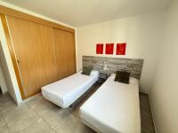 A bed or beds in a room at Agi Riera Ginjolers