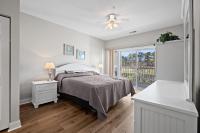 Ein Bett oder Betten in einem Zimmer der Unterkunft World Tour Golf Resort 206