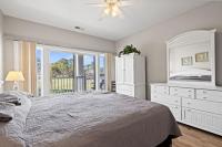 Ein Bett oder Betten in einem Zimmer der Unterkunft World Tour Golf Resort 206
