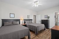 Ein Bett oder Betten in einem Zimmer der Unterkunft World Tour Golf Resort 206