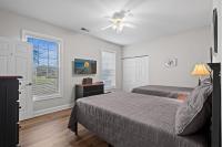 Ein Bett oder Betten in einem Zimmer der Unterkunft World Tour Golf Resort 206