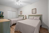 Ein Bett oder Betten in einem Zimmer der Unterkunft World Tour Golf Resort 206