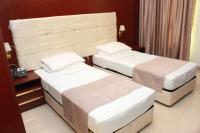 Golden Airport Hotelにあるベッド
