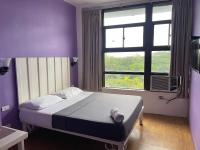The Purple Tree Hostelにあるベッド