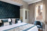 Postel nebo postele na pokoji v ubytování Londra Palace Venezia