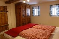A bed or beds in a room at Landhaus Oberlehen