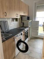 Kuchnia lub aneks kuchenny w obiekcie Sweet-home erkélyes apartman Kaposvár
