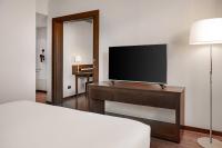 Televízia a/alebo spoločenská miestnosť v ubytovaní AC Hotel Barcelona Fórum by Marriott