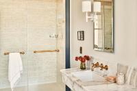 a bathroom with a sink and a shower at Hotel Per La, Autograph Collection in Los Angeles